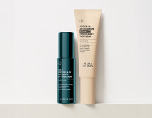 Allies of Skin skincare set featuring a dark teal bottle of Multi Peptides & GF Advanced Lifting Serum next to a beige tube of Peptides & Antioxidants Advanced Firming Daily Treatment on a light gray background.